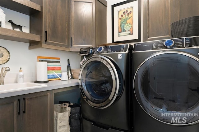 12013 W Zamalek Ct, Kuna, ID 83634 - laundry room featuring cabinet space and washer and dryer