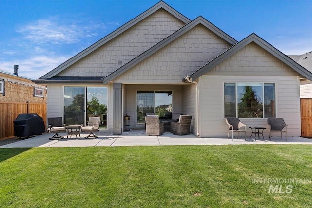 12013 W Zamalek Ct, Kuna, ID 83634 - back of property with a patio and an outdoor living space