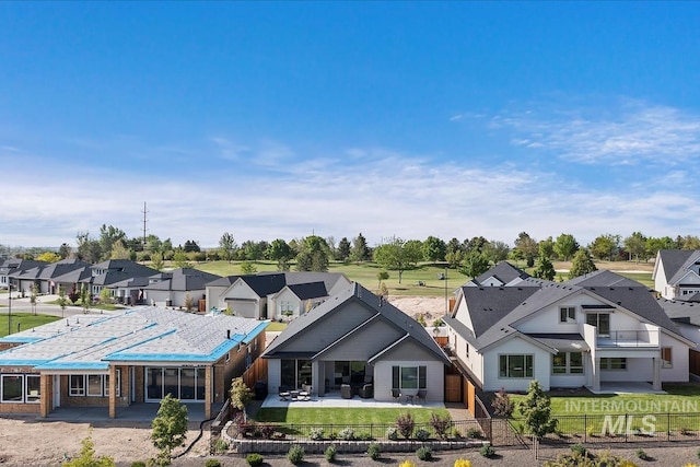 12013 W Zamalek Ct, Kuna, ID 83634 - rear view of property with a residential view, a fenced backyard, and a patio area