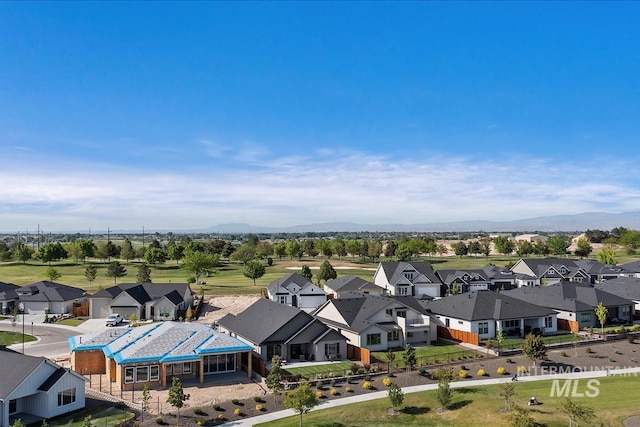 12013 W Zamalek Ct, Kuna, ID 83634 - aerial perspective of suburban area featuring a mountainous background
