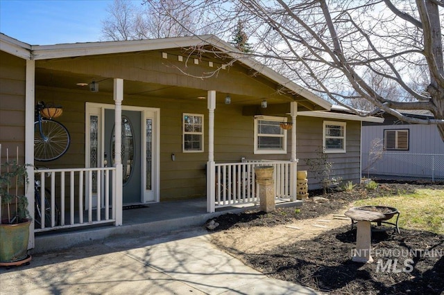 doorway to property with covered porch