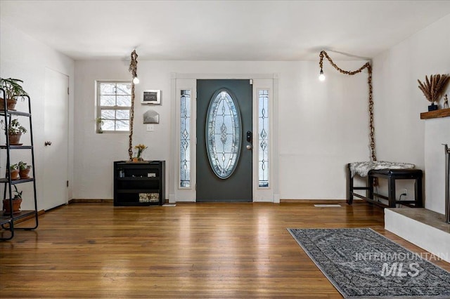 foyer featuring wood finished floors