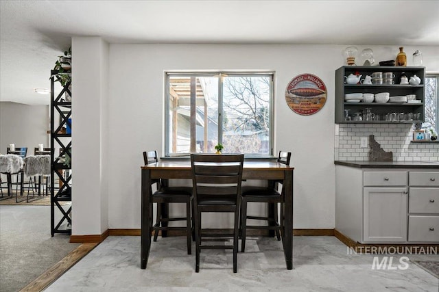 dining space with baseboards