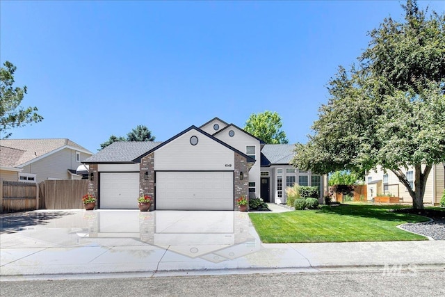 1049 N Purple Sage Way, Eagle, ID 83616 - view of front of home featuring a garage, driveway, and brick siding