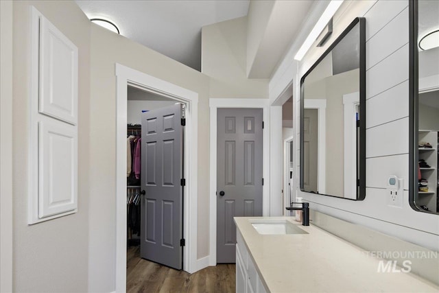 1049 N Purple Sage Way, Eagle, ID 83616 - bathroom featuring wood finished floors, vanity, and a spacious closet