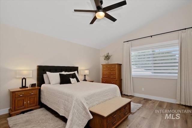 1049 N Purple Sage Way, Eagle, ID 83616 - bedroom with vaulted ceiling, light wood-type flooring, and ceiling fan