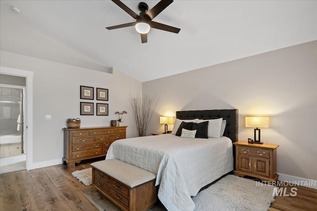 1049 N Purple Sage Way, Eagle, ID 83616 - bedroom with wood finished floors, vaulted ceiling, and a ceiling fan