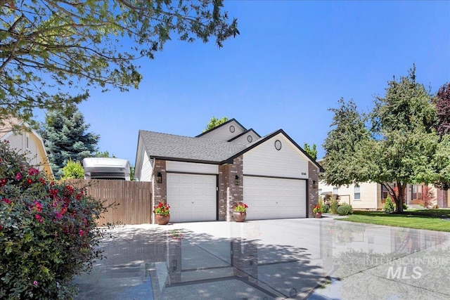 1049 N Purple Sage Way, Eagle, ID 83616 - view of front of property featuring an attached garage, concrete driveway, and brick siding