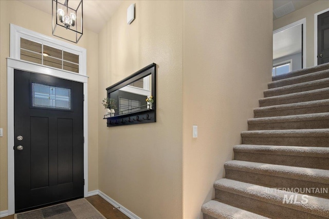 1049 N Purple Sage Way, Eagle, ID 83616 - entryway featuring stairway and dark wood-style flooring