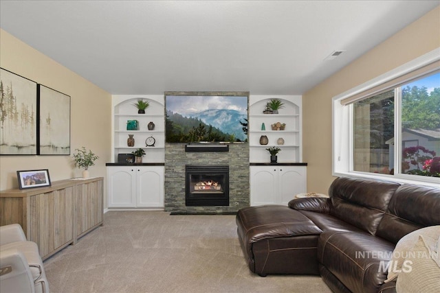 1049 N Purple Sage Way, Eagle, ID 83616 - living area with a fireplace, light colored carpet, and built in features