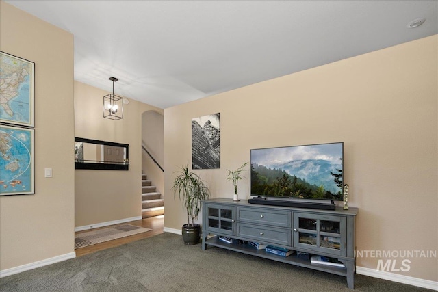 1049 N Purple Sage Way, Eagle, ID 83616 - living room with carpet floors, stairs, and a chandelier