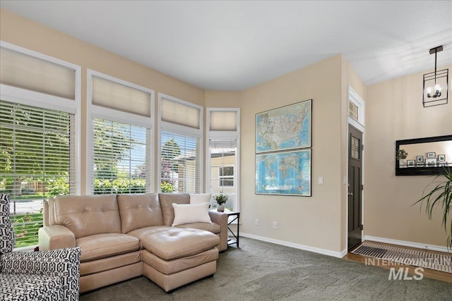 1049 N Purple Sage Way, Eagle, ID 83616 - carpeted living room featuring plenty of natural light and a chandelier