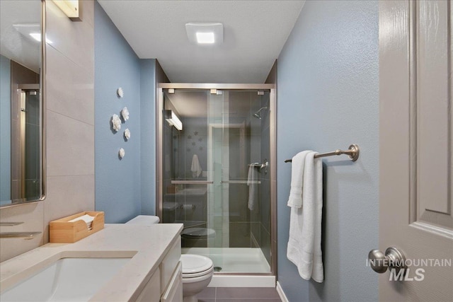 1049 N Purple Sage Way, Eagle, ID 83616 - full bath with vanity, a stall shower, and tile patterned floors