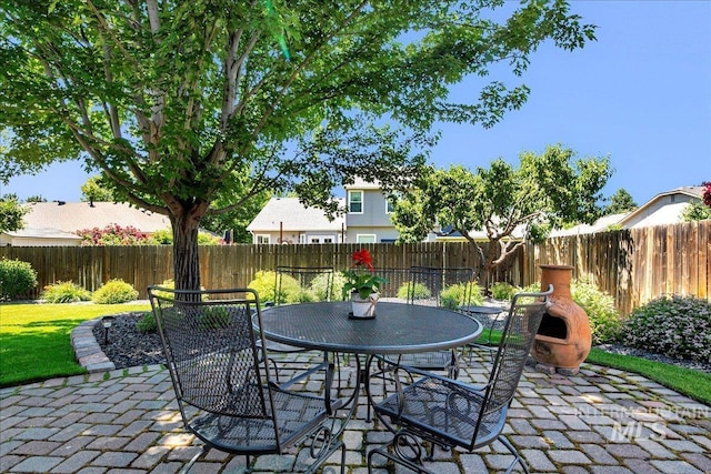 1049 N Purple Sage Way, Eagle, ID 83616 - fenced backyard with a patio and outdoor dining area