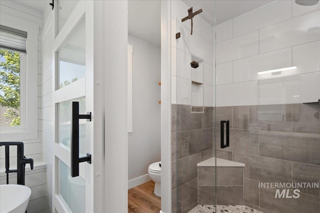 1049 N Purple Sage Way, Eagle, ID 83616 - bathroom featuring a stall shower and wood finished floors