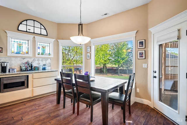 4965 S Nickel Creek Ave, Meridian, ID 83642 - dining area featuring baseboards, dark wood-style floors, and visible vents