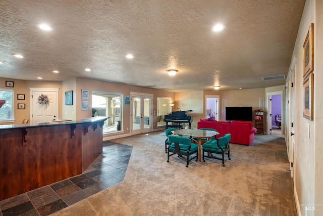 4965 S Nickel Creek Ave, Meridian, ID 83642 - carpeted dining space featuring a textured ceiling, visible vents, french doors, and recessed lighting