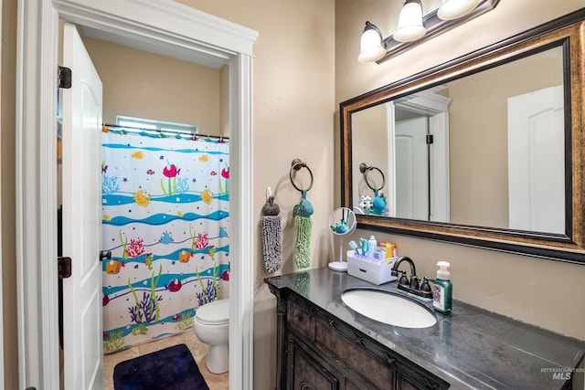 4965 S Nickel Creek Ave, Meridian, ID 83642 - bathroom with curtained shower, vanity, toilet, and tile patterned flooring
