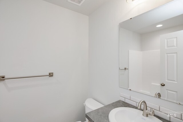 11069 Canvas St, Caldwell, ID 83605 - bathroom featuring toilet, vanity, and visible vents