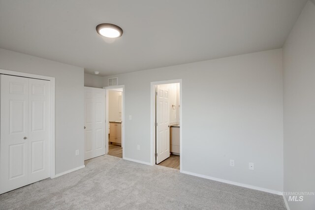 11069 Canvas St, Caldwell, ID 83605 - unfurnished bedroom with a closet, carpet floors, visible vents, and baseboards