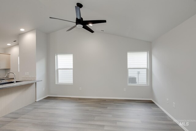 11069 Canvas St, Caldwell, ID 83605 - unfurnished living room with visible vents, baseboards, a ceiling fan, lofted ceiling, and light wood-type flooring