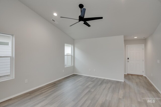 11069 Canvas St, Caldwell, ID 83605 - spare room featuring vaulted ceiling, a ceiling fan, light wood-type flooring, baseboards, and visible vents