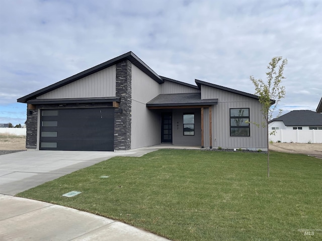467 Hope Ave, Twin Falls, ID 83301 - view of front of property featuring driveway, a garage, and stone siding