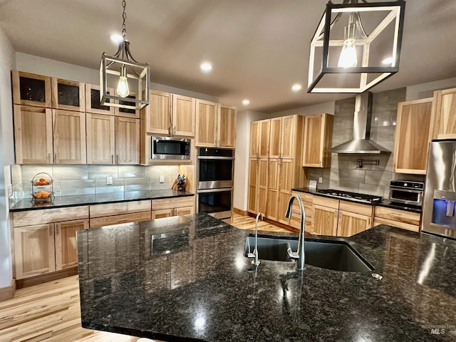 1321 Lande Ln, Moscow, ID 83843 - kitchen featuring light brown cabinetry, a sink, appliances with stainless steel finishes, wall chimney range hood, and decorative backsplash
