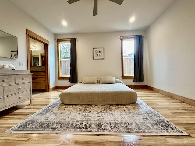 1321 Lande Ln, Moscow, ID 83843 - bedroom with light wood-style flooring, multiple windows, and ceiling fan