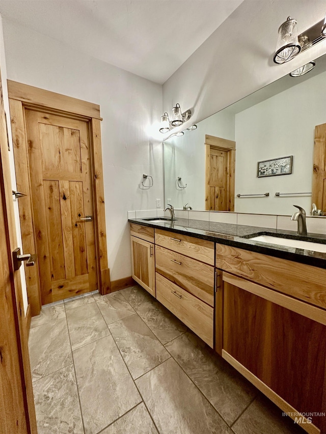 1321 Lande Ln, Moscow, ID 83843 - full bath with a sink, baseboards, and double vanity