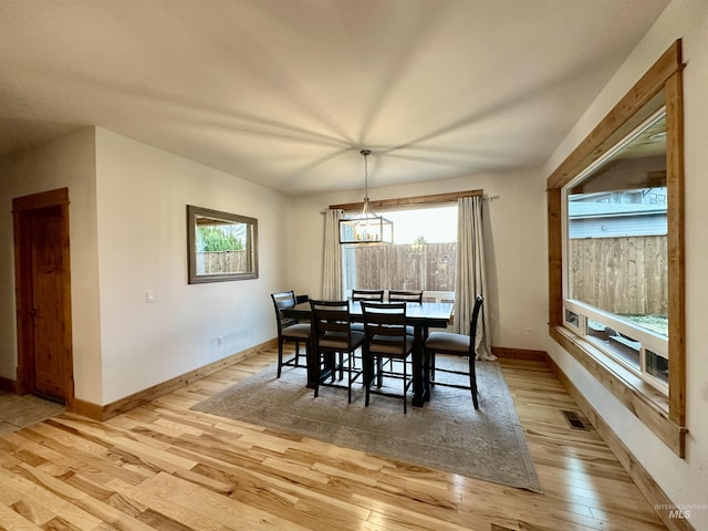 1321 Lande Ln, Moscow, ID 83843 - dining space with light wood finished floors, visible vents, an inviting chandelier, and baseboards