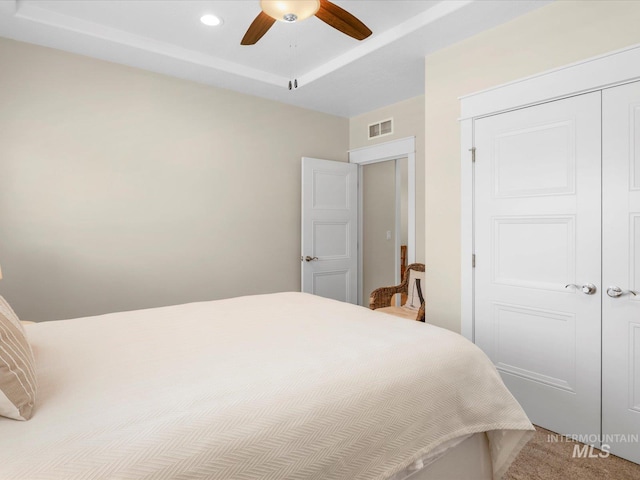 carpeted bedroom featuring recessed lighting, a ceiling fan, visible vents, and a closet