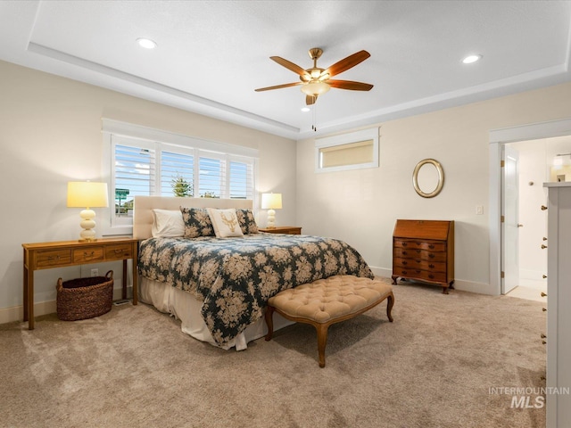 bedroom featuring a ceiling fan, baseboards, recessed lighting, a raised ceiling, and carpet flooring