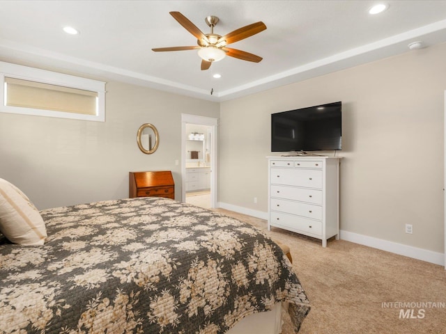 bedroom featuring light colored carpet, recessed lighting, baseboards, and connected bathroom