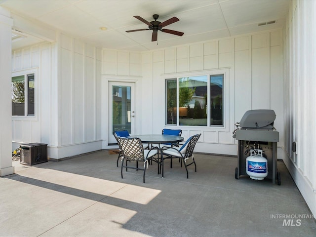 view of patio / terrace featuring visible vents, a ceiling fan, outdoor dining area, and area for grilling