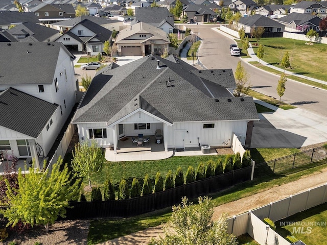 birds eye view of property with a residential view
