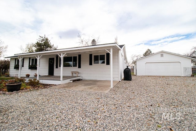 1627 Verdant Ct, Emmett, ID 83617 - ranch-style house featuring covered porch, a garage, and an outdoor structure