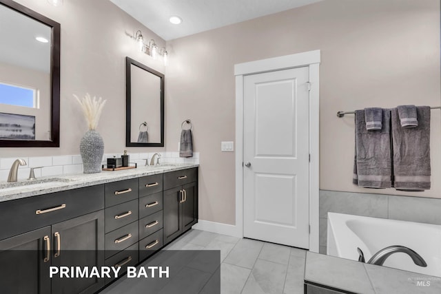 9478 W Napier St, Star, ID 83669 - full bathroom featuring double vanity, a bathtub, and baseboards