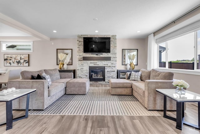 9478 W Napier St, Star, ID 83669 - living room with wood finished floors, a stone fireplace, and recessed lighting