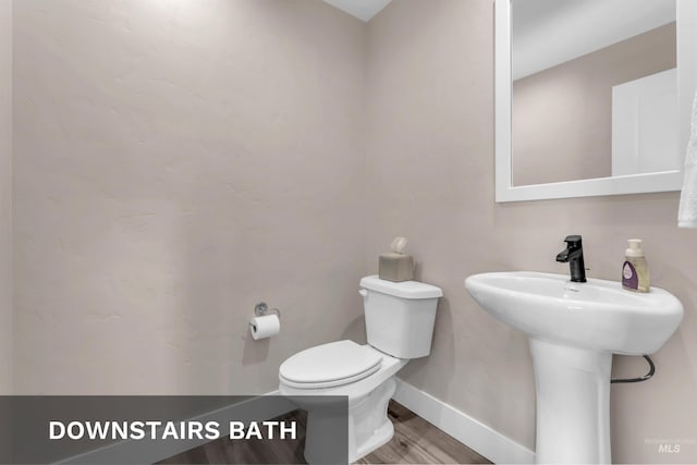 9478 W Napier St, Star, ID 83669 - bathroom with toilet, wood finished floors, and baseboards