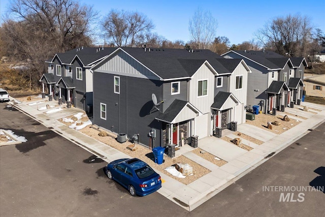 birds eye view of property with a residential view