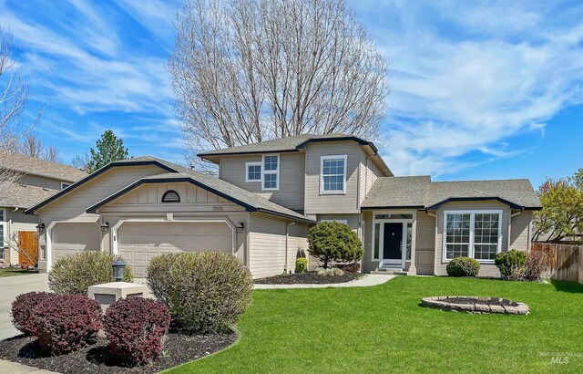 2506 S Culpeper Ave, Boise, ID 83709 - view of front of home with a front lawn, fence, roof with shingles, and a garage