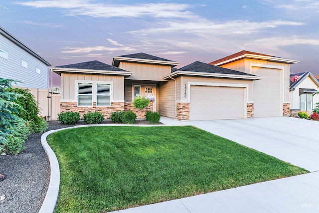 18160 N Begonia Way, Nampa, ID 83687 - view of front of property featuring a garage, stone siding, board and batten siding, driveway, and roof with shingles