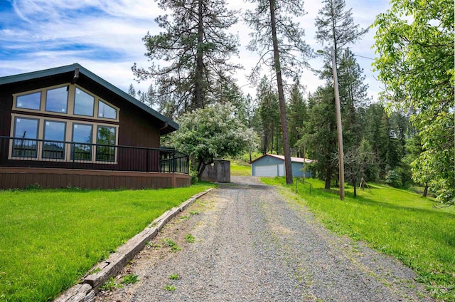 121 Valley View Ln, Kamiah, ID 83536 - view of property exterior featuring an outbuilding, a lawn, driveway, and a garage