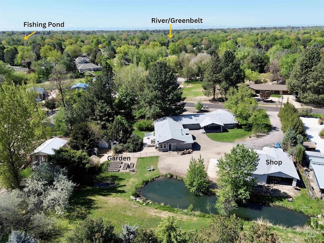 aerial view featuring a wooded view
