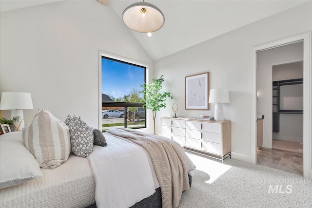 bedroom featuring baseboards, high vaulted ceiling, and light carpet
