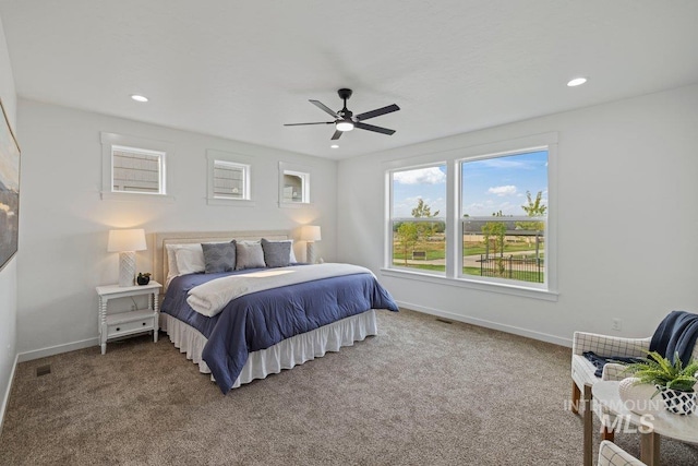 carpeted bedroom with ceiling fan