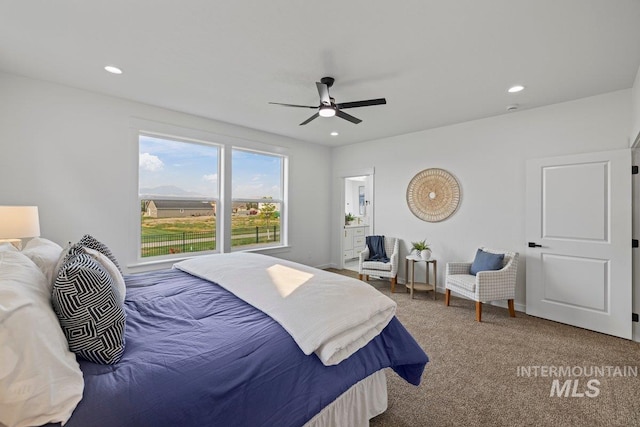 carpeted bedroom with ceiling fan