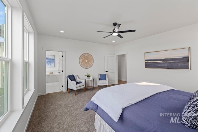 carpeted bedroom featuring ceiling fan and ensuite bath