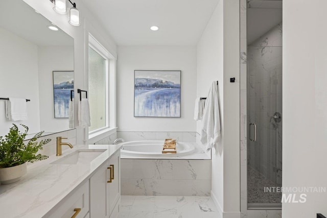 bathroom featuring vanity and plus walk in shower